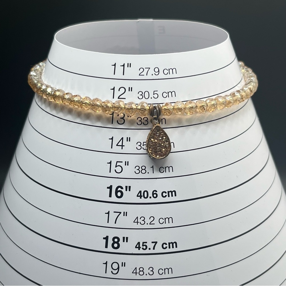 Modern light amber colored crystal choker with a teardrop rhinestone pendant. - Picture 4 of 9